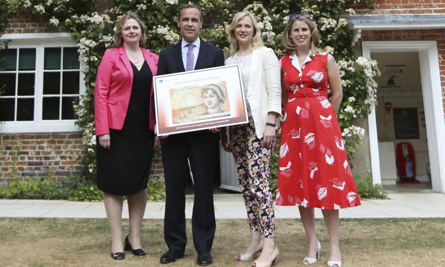 Caroline Criado-Perez (far-right) poses with new £10 note, featuring Jane Austen, in 2013.