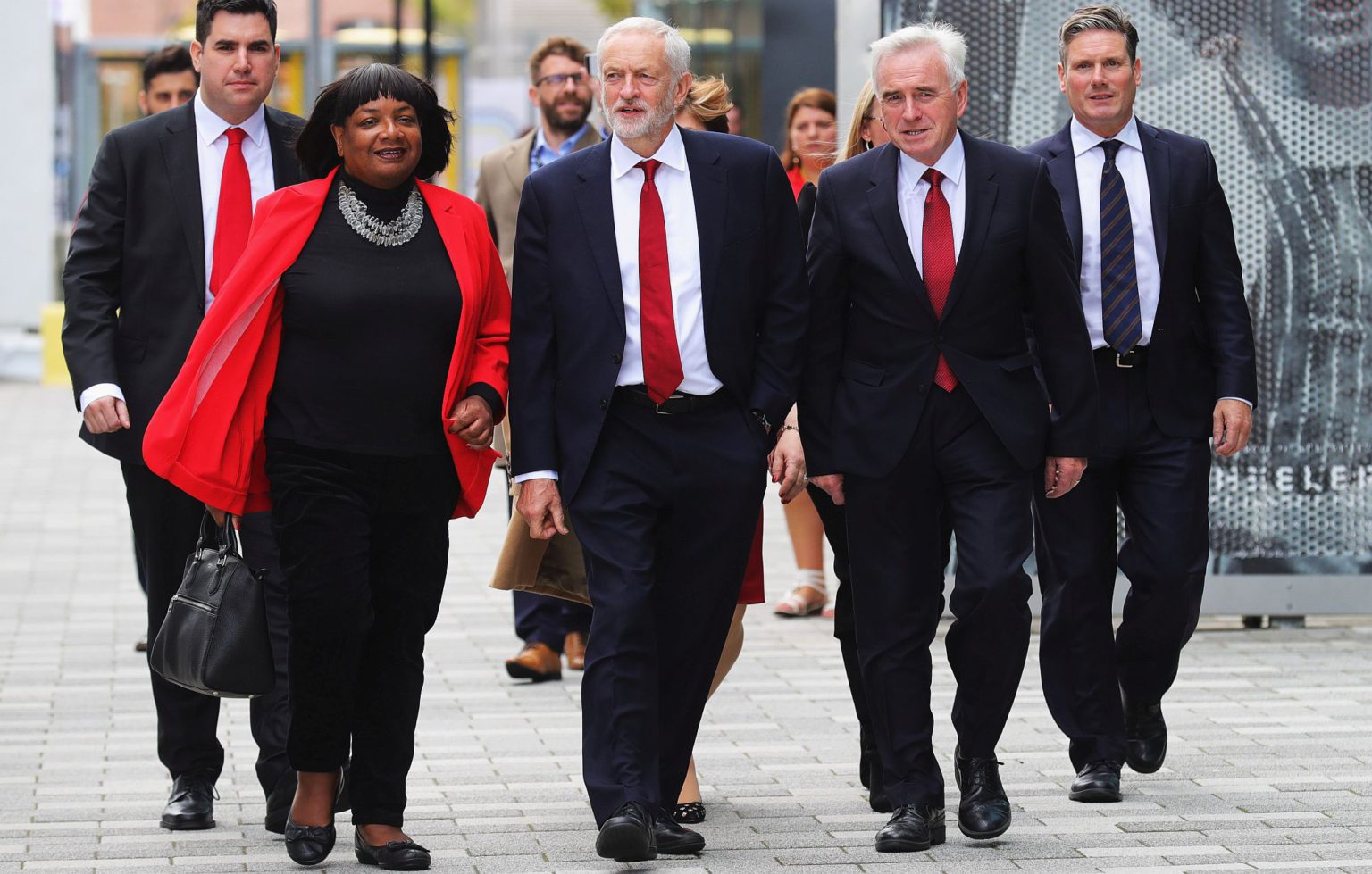 Corbyn (C), with shadow home secretary Diane Abbott (L) and McDonnell (R) arriving at the Labour Party conference, 2018