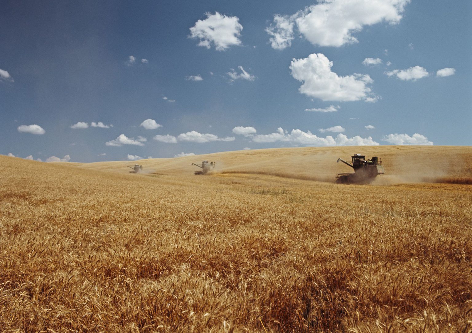 Crop spraying in a wheat field in Washington State, US, circa 1970.