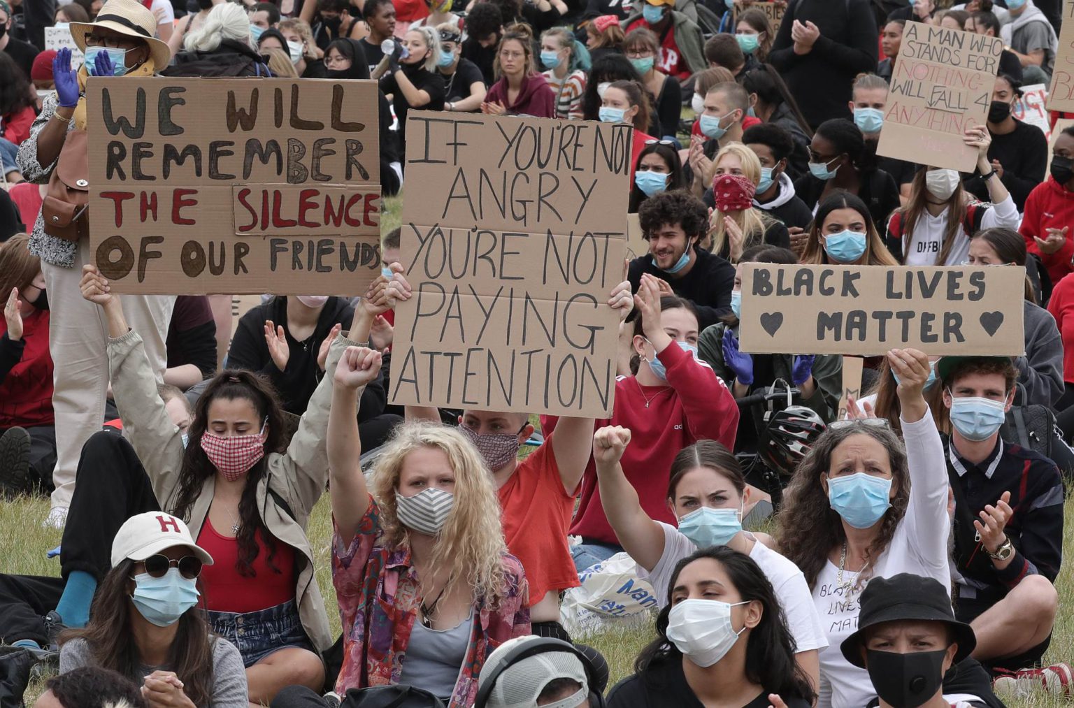 Protesters hold up signs during a Black Lives Matter protest in Hyde Park, London, on 3 June 2020.