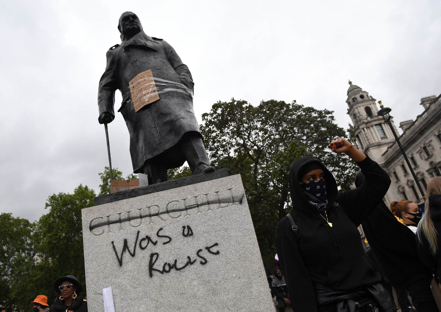 Protesters gather in Parliament Square Garden around the statue of Winston Churchill, in Westminster, on 7 June 2020.