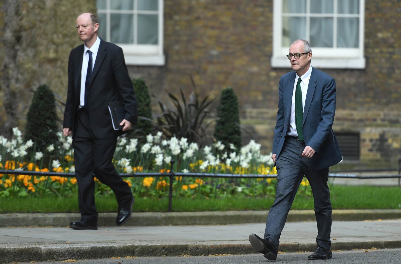Chief medical officer Chris Whitty (left) and chief scientific officer Patrick Vallance arrive at Downing Street on 9 April 2020.