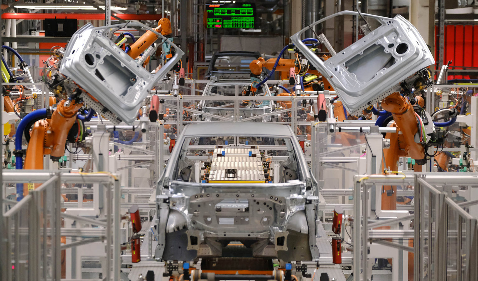 Robots attach doors an ID.3 electric car at the Volkswagen factory in Zwickau, Germany, 25 February 2020.