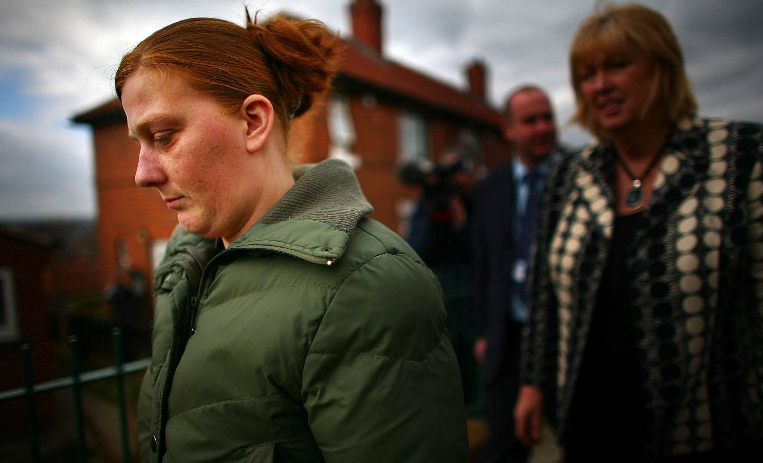 Karen Matthews is led away by detectives, 17 March 2008, Dewsbury, England.