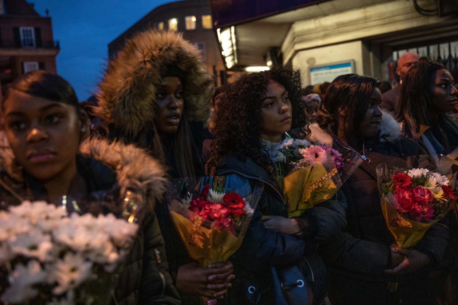 Friends and family gather at the scene in London where 17-year-old Malcolm Mide-Madariola was killed, 5 November 2018.