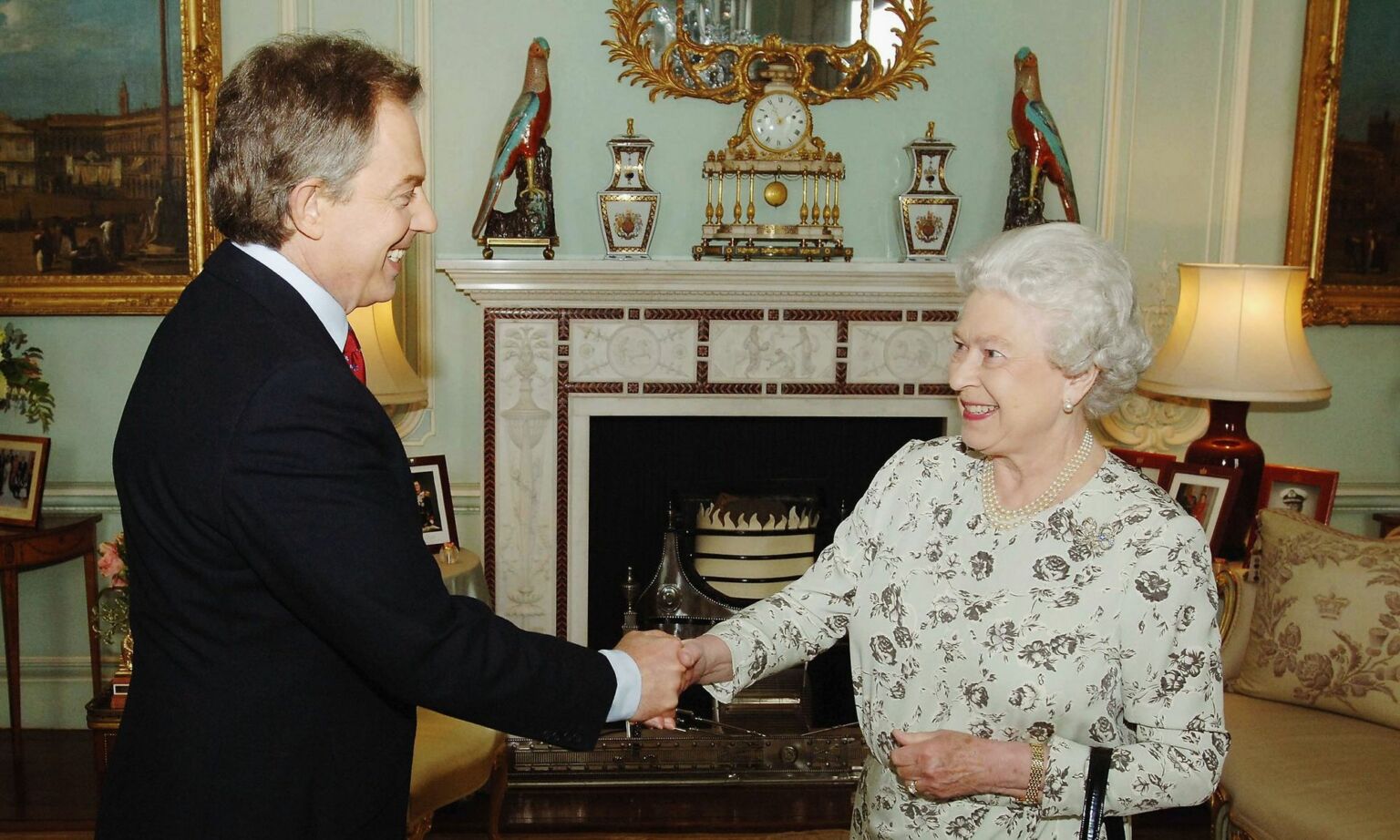 Prime minister Tony Blair shakes hands with Queen Elizabeth II during an engagement at Buckingham Palace, 6 May 2005.