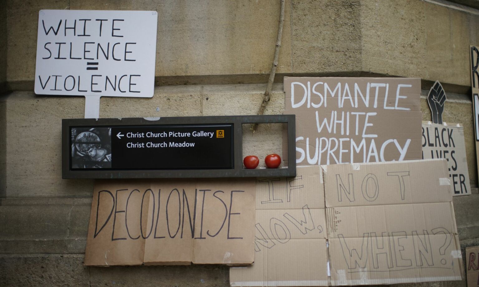 Placards are left outside University of Oxford's Oriel College during a protest of the Rhodes Must Fall campaign, 9 June 2020.
