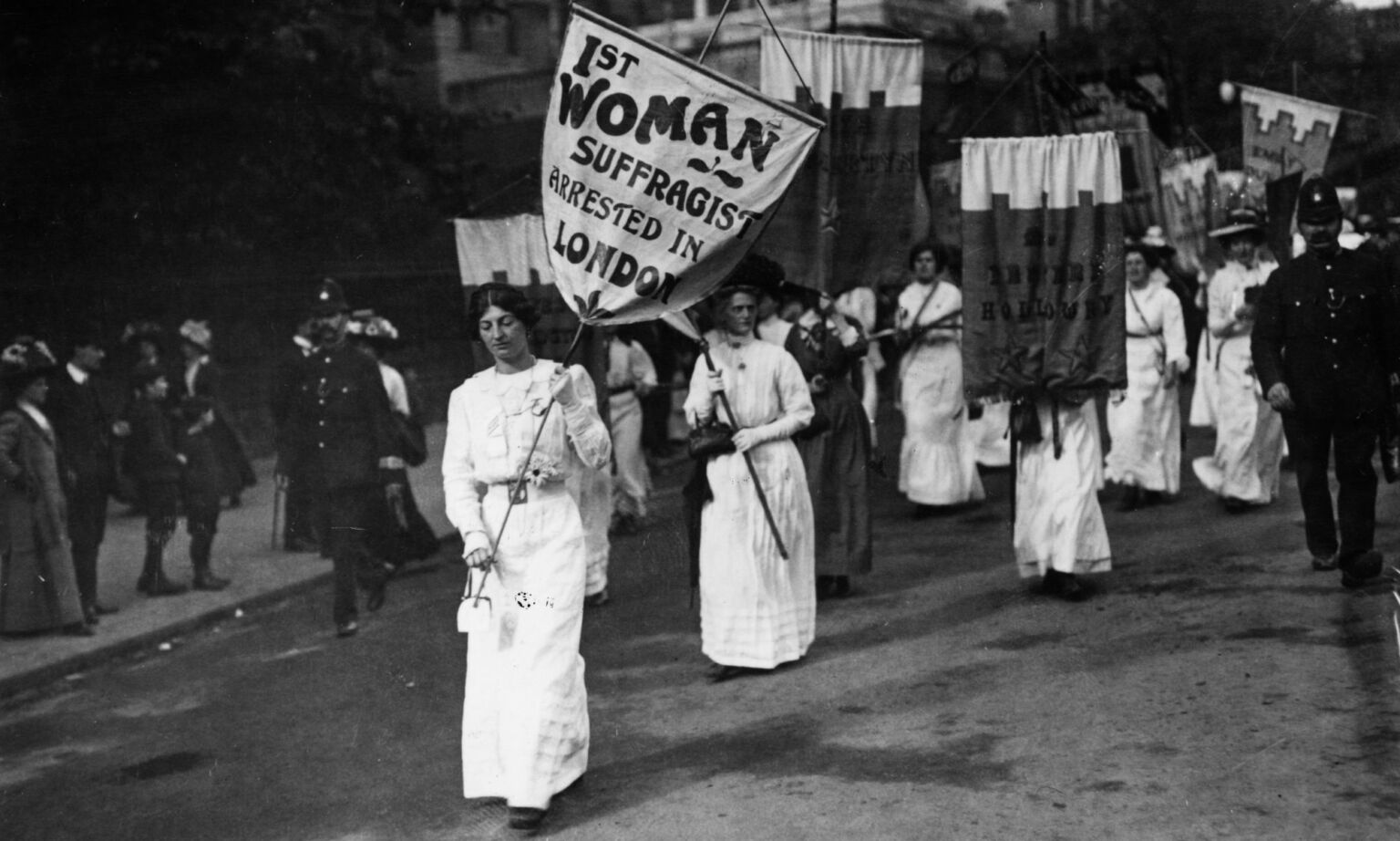 A protest march by women suffragettes in London with police in attendance, 1913.