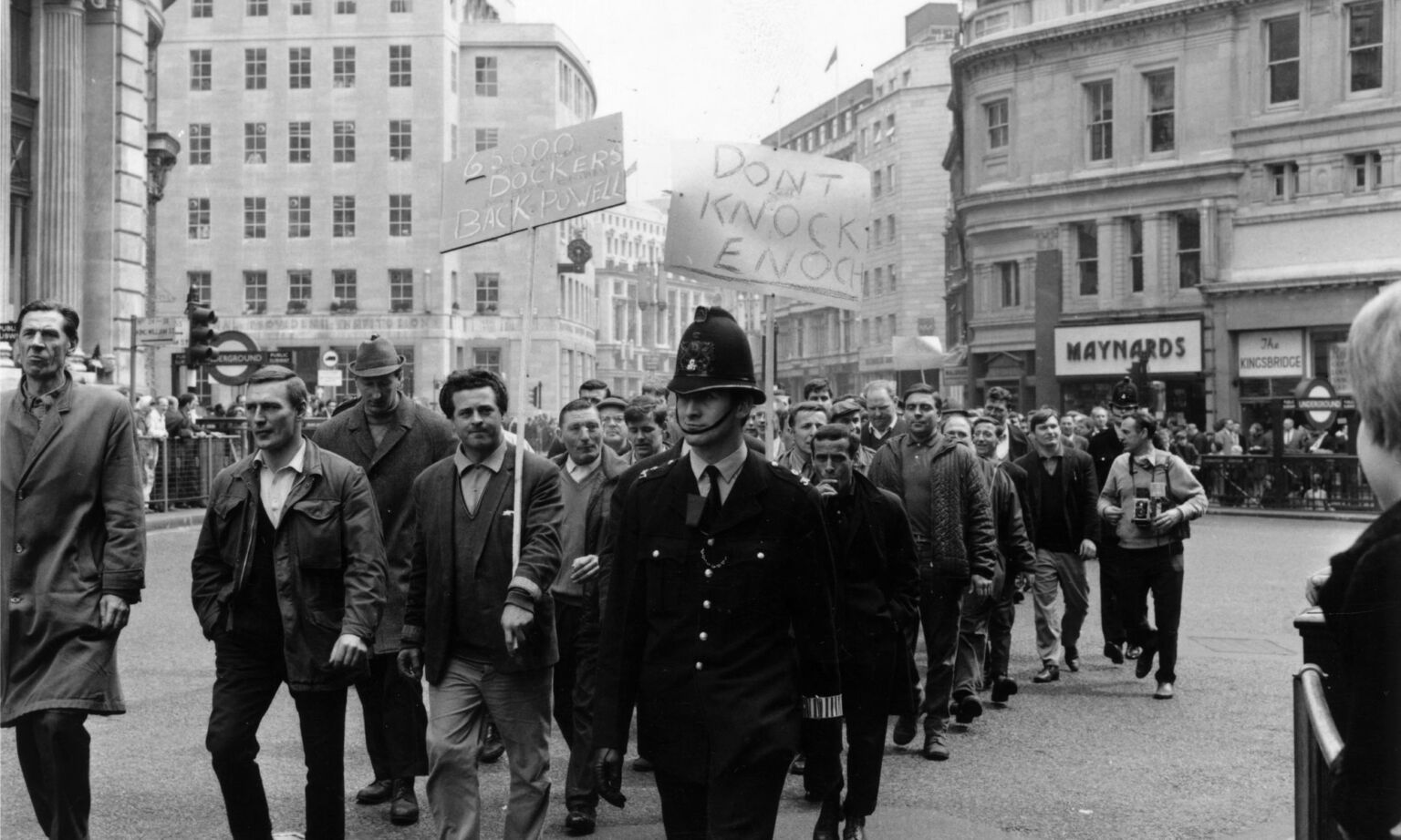 Demonstrating dock workers march past Monument in the City of London, in support of Enoch Powell, on their way to the House of Commons, April 1968.