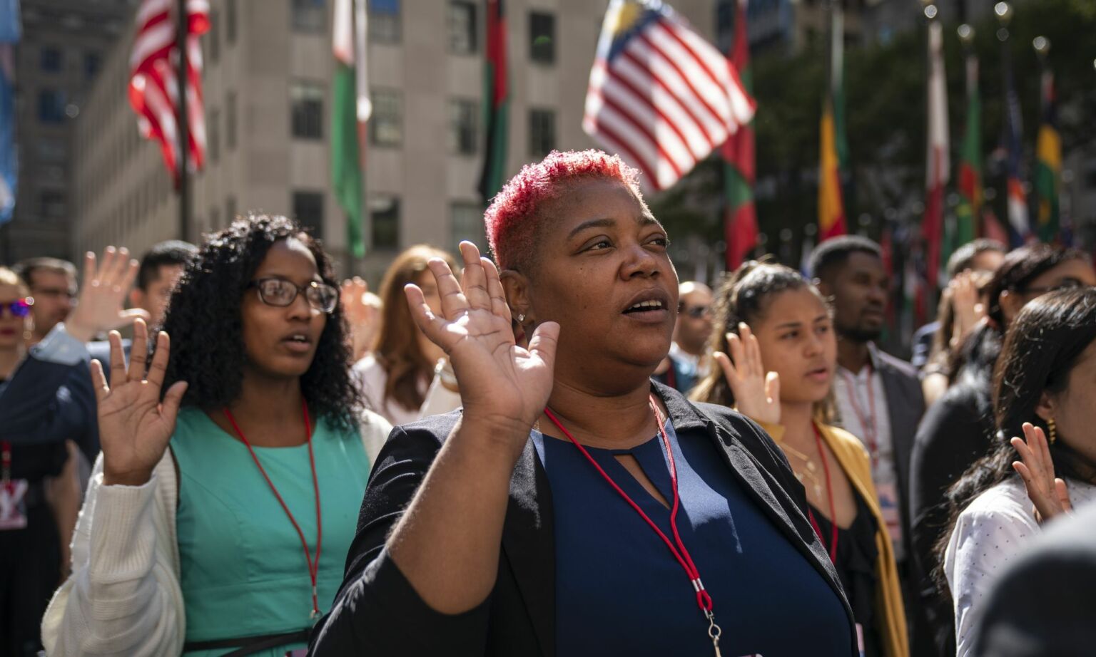 New US citizens recite the the Oath of Allegiance during a naturalisation ceremony at Rockefeller Center on 17 September 2019 in New York City. Hailing from 33 different countries, 50 people officially became new US citizens at the ceremony.