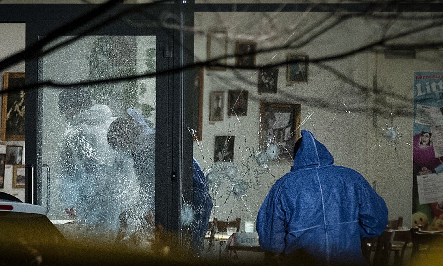 Forensic police officers work at the scene of an Islamist terror attack in Copenhagen, 14  February 2015. 