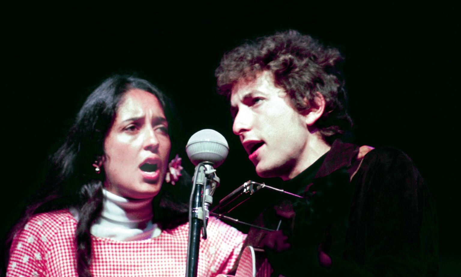 Joan Baez and Bob Dylan performing at the Newport Folk Festival on 1 July 1964.