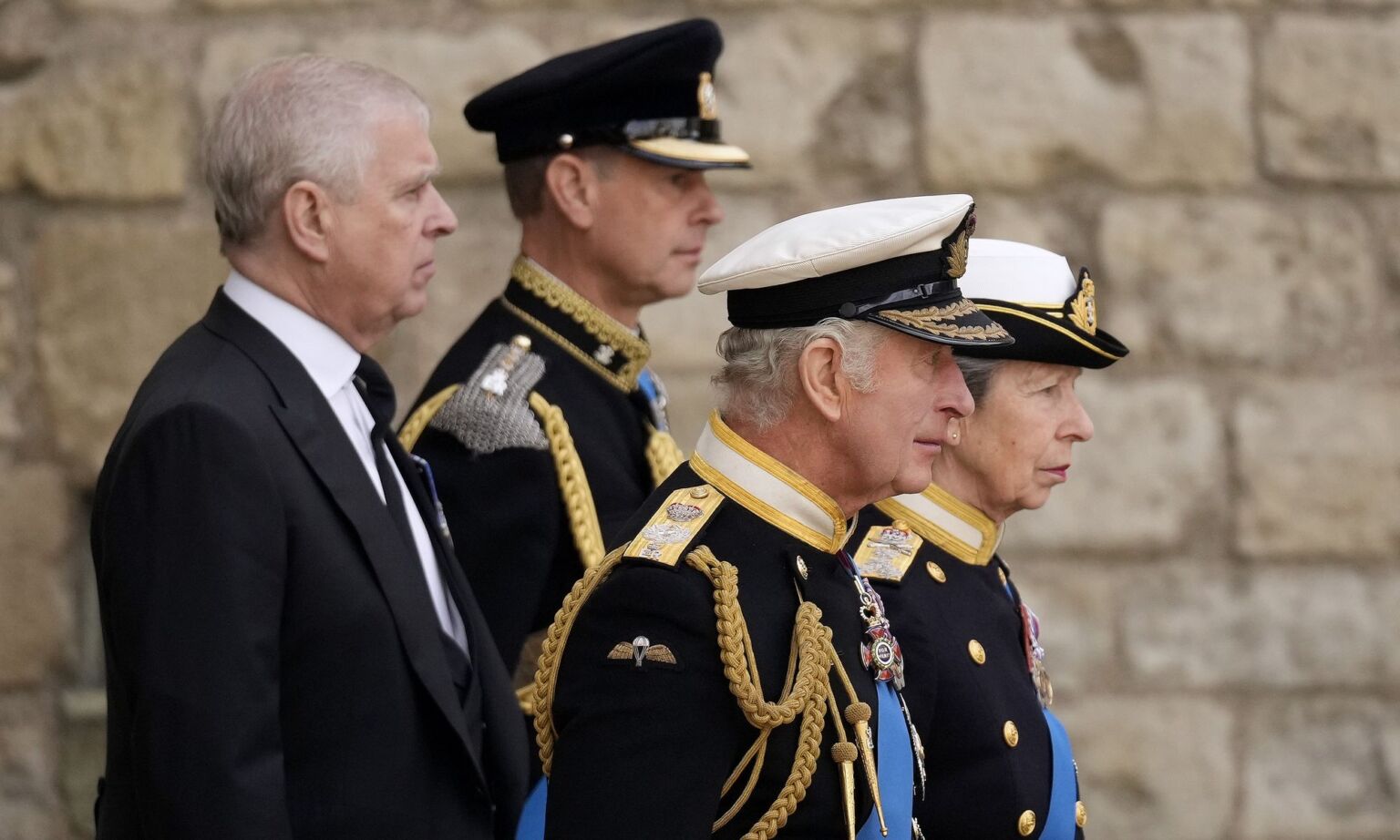 Prince Andrew, Prince Edward, King Charles III and Princess Anne walk behind Queen's Elizabeth's funeral cortege in 2022 in London, England.