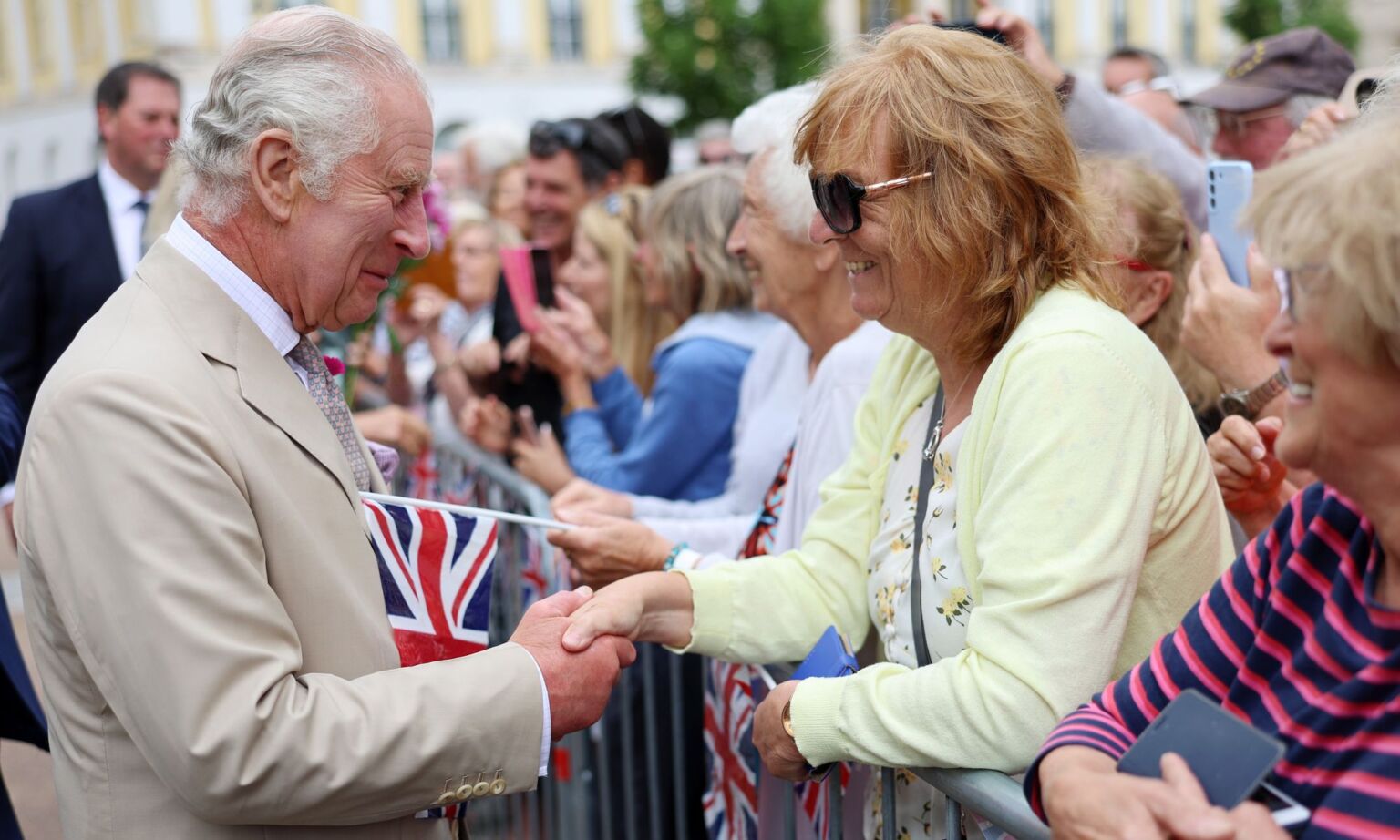 King Charles III meets with members of the public during his visit to Poundbury in 2023.