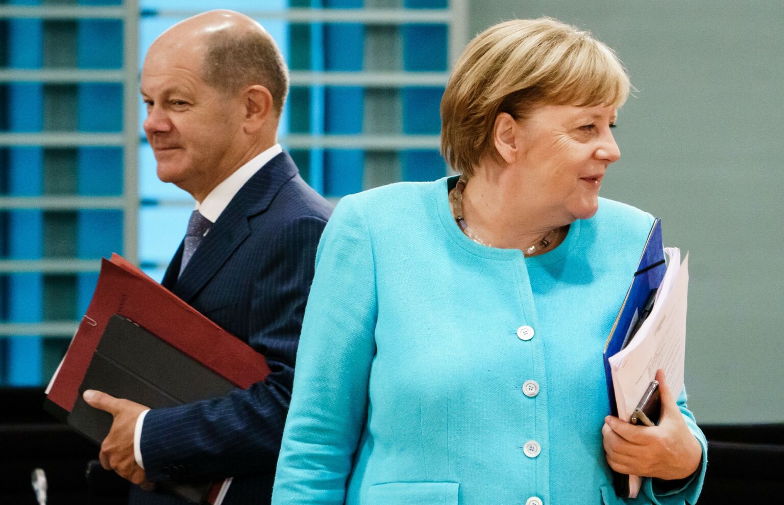 Then chancellor Angela Merkel and minister of finance Olaf Scholz attend a cabinet meeting in Berlin, Germany, 2020.