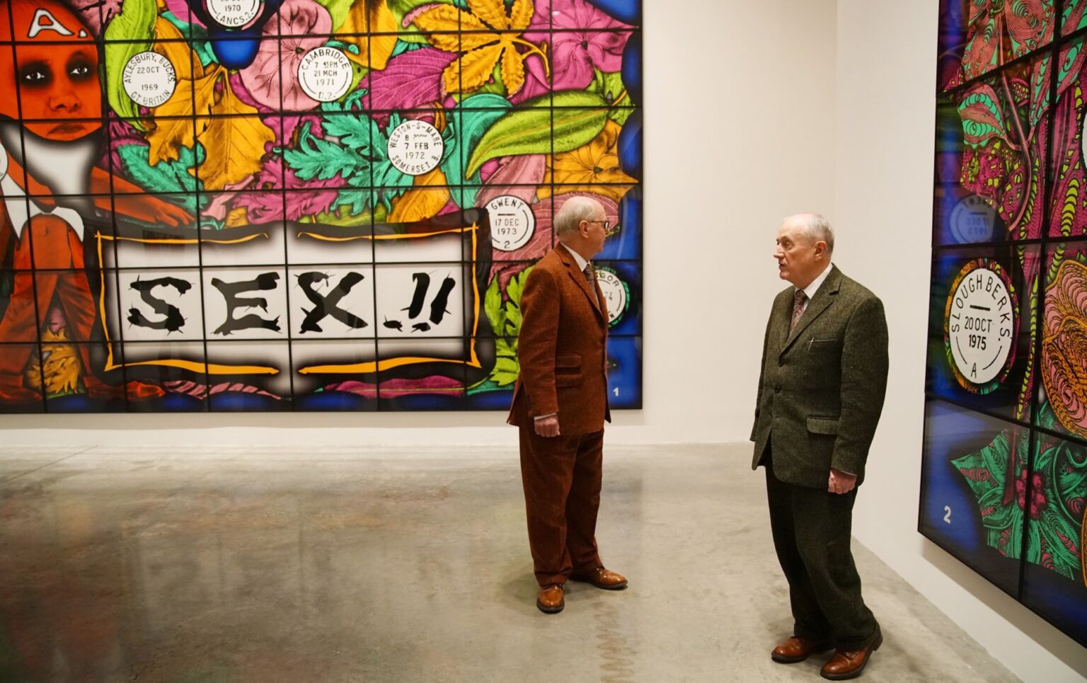 Gilbert and George pose for pictures during the press preview for 'The Beard Pictures and their Fuckosophy', 21 November 2017 in London, England. 