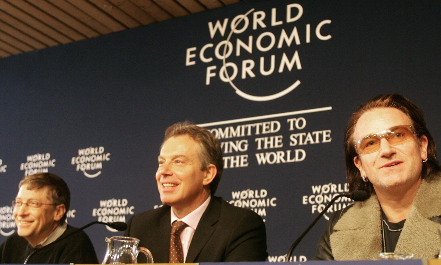 Prime minister Tony Blair (C), Irish singer Bono (R) and Microsoft chairman Bill Gates (L) at the World Economic Forum, Davos, 27 January 2005.