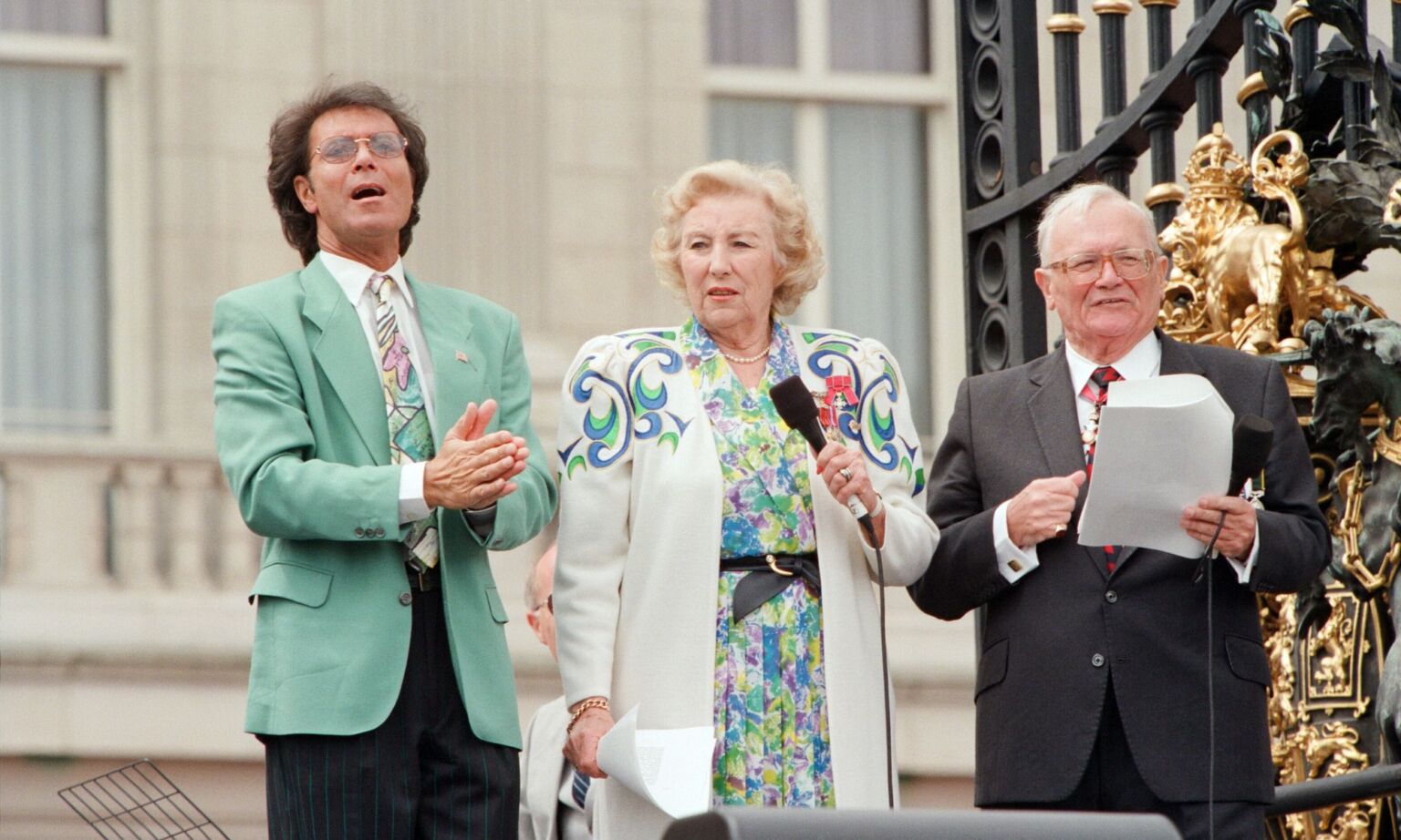 Cliff Richard, Vera Lynn and Harry Secombe singing for the crowds gathered at Buckingham Palace for Second World War VE Day 50th anniversary celebrations, 8 May 1995.