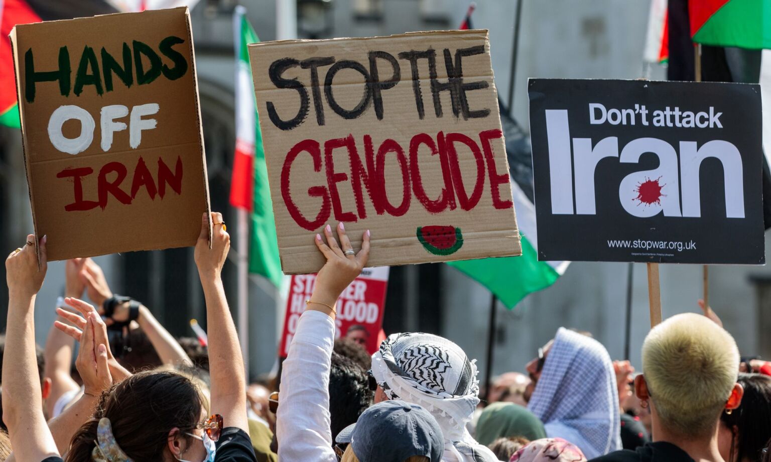 Activists in Parliament Square, London, protesting against Israel's attacks on Iran and Gaza on 14 June 2025.