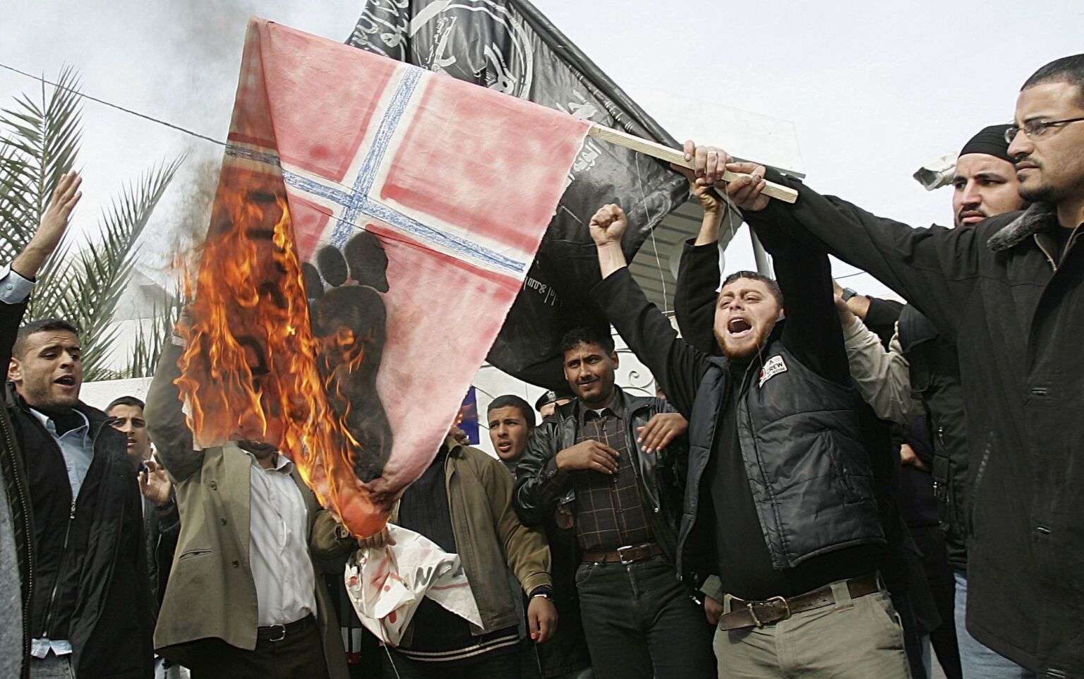 Palestinians burn a Norwegian flag after a Norwegian newspaper republished the cartoons in the Gaza Strip, on 30 January 2006.