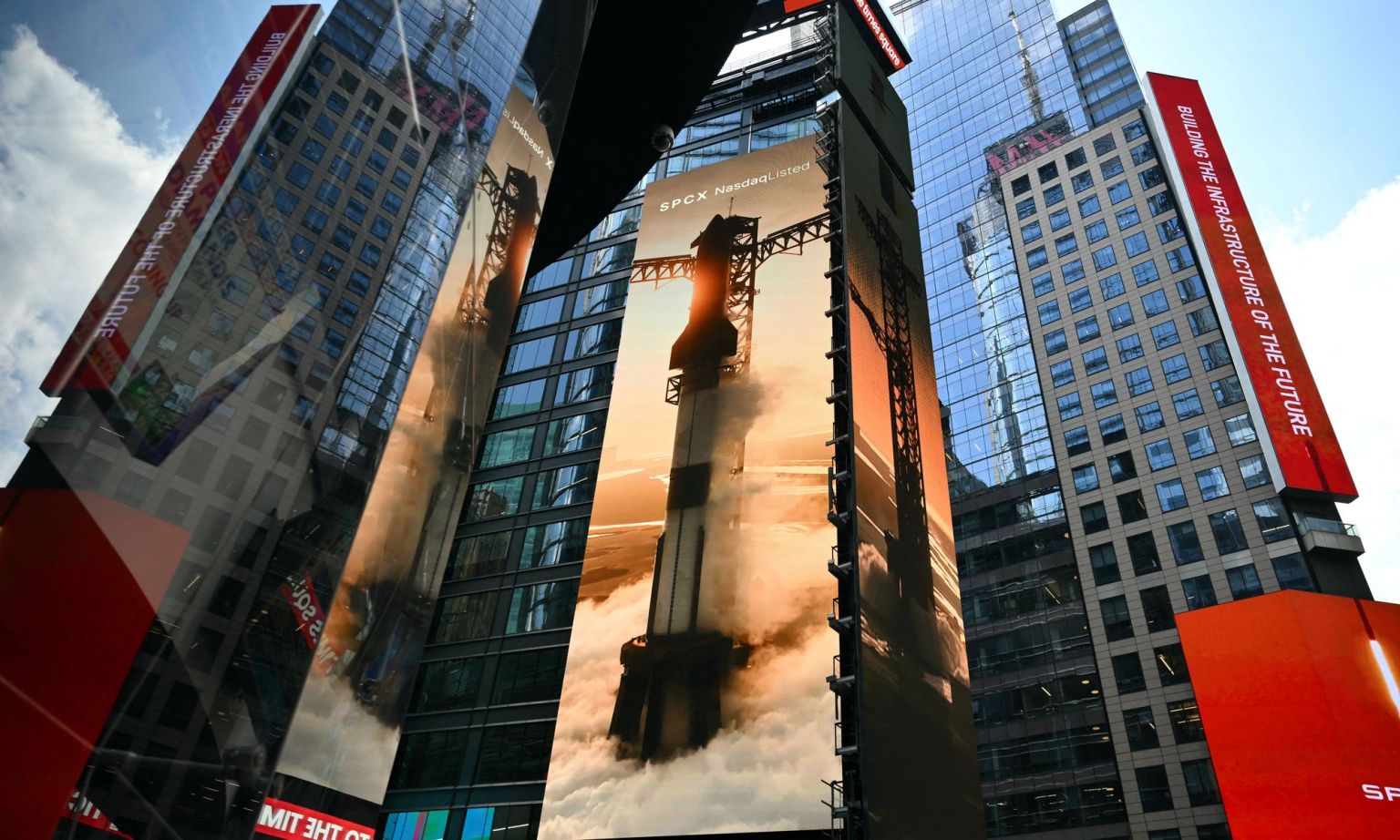Images of SpaceX rockets are displayed on screens in Times Square near the Nasdaq MarketSite after the launch of SpaceX's initial public offering (IPO) in New York on 12 June 2026.